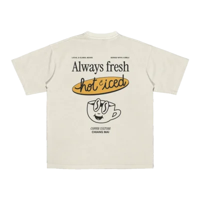 Flat lay of Amici al Sole's “Coffee Culture” t-shirt, celebrating slow mornings with a hot or iced coffee by your side.
