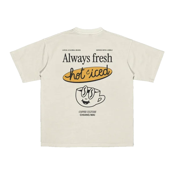 Flat lay of Amici al Sole's “Coffee Culture” t-shirt, celebrating slow mornings with a hot or iced coffee by your side.