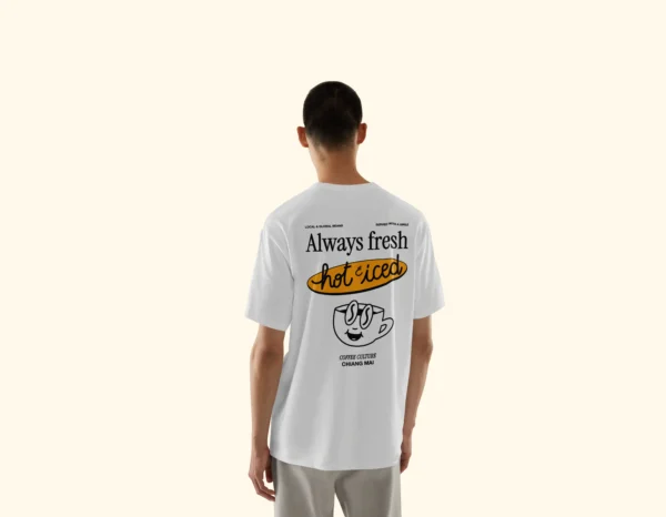 Model wearing Amici al Sole's "Coffee Culture" illustrated t-shirt.