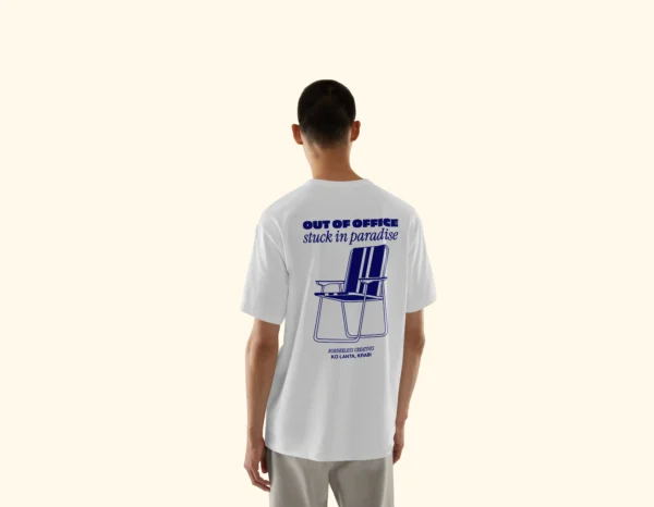 Model wearing Amici al Sole's "Out of Office" illustrated t-shirt.