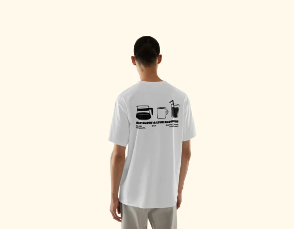 Model wearing Amici al Sole's "Slow Life" illustrated t-shirt.